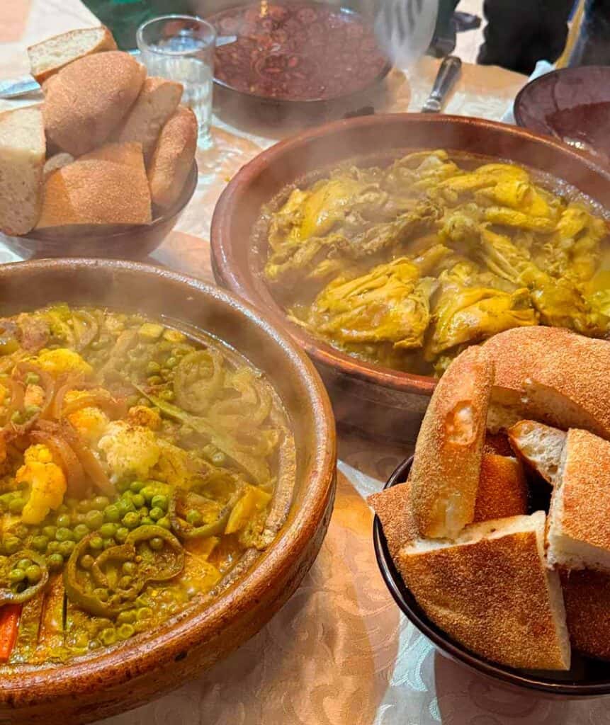 freshly cooked tagines served with fresh bread for lunch at a class in Marrakech Medina