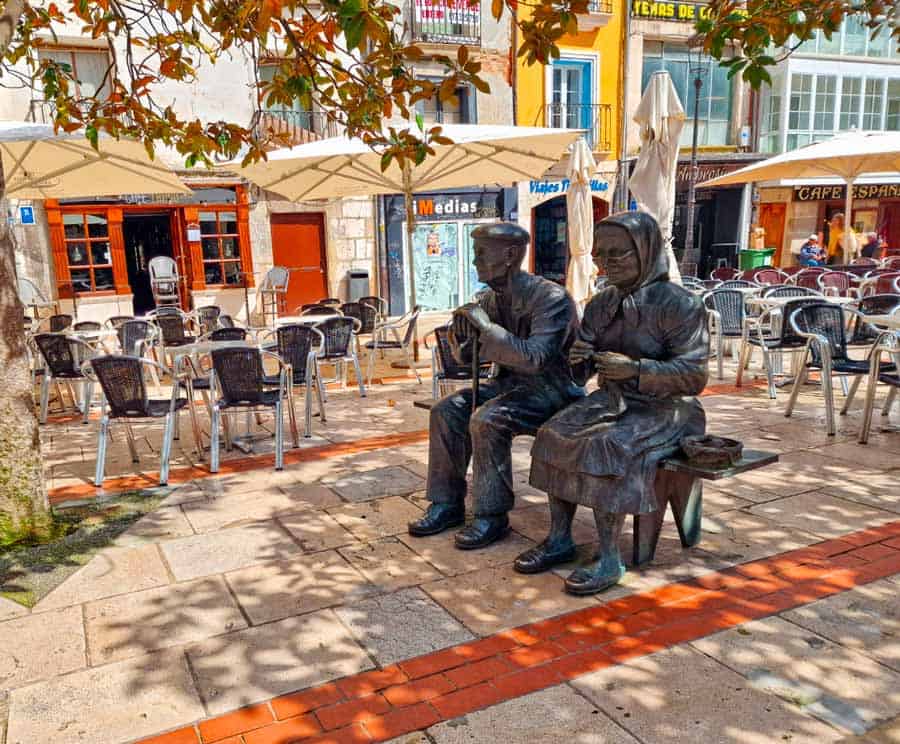 street art and cafe tables in the shade in burgos old town
