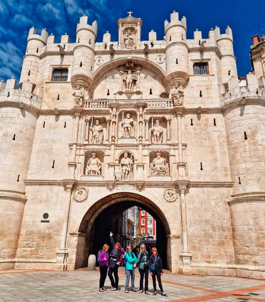 colleen and her camino walking group arriving at the Arco de Santa María in Burgos