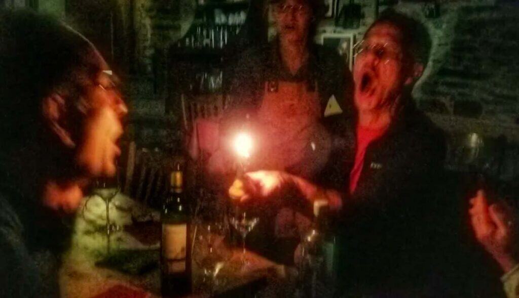 gerry's birthday cake on the Camino Primitivo - blowing out the candles