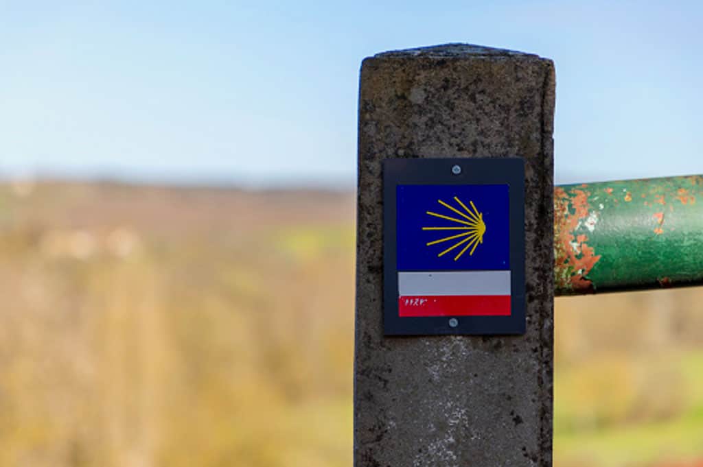 camino shell on a blue sign with a GR makers below