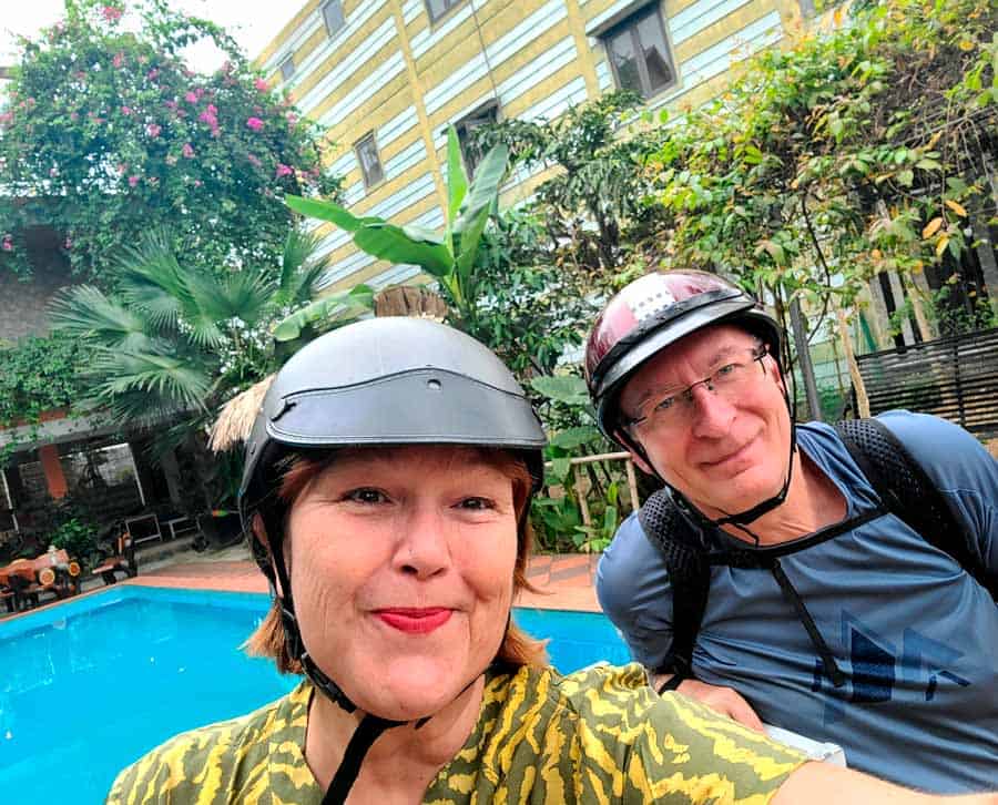 Colleen and Gerry waiting for our ride beside the pool at our homestay in Phong Nha