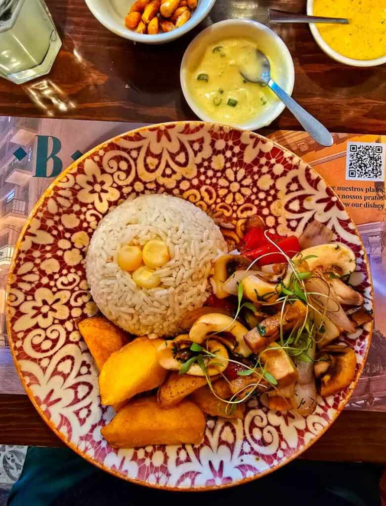 traditional Peruvian Lunch rice, vegetables and spicy sauce