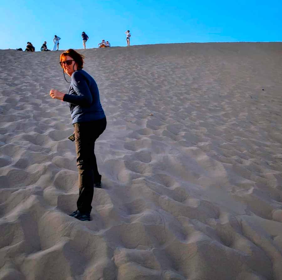 colleen almost at the top of the big dune at Huacachina