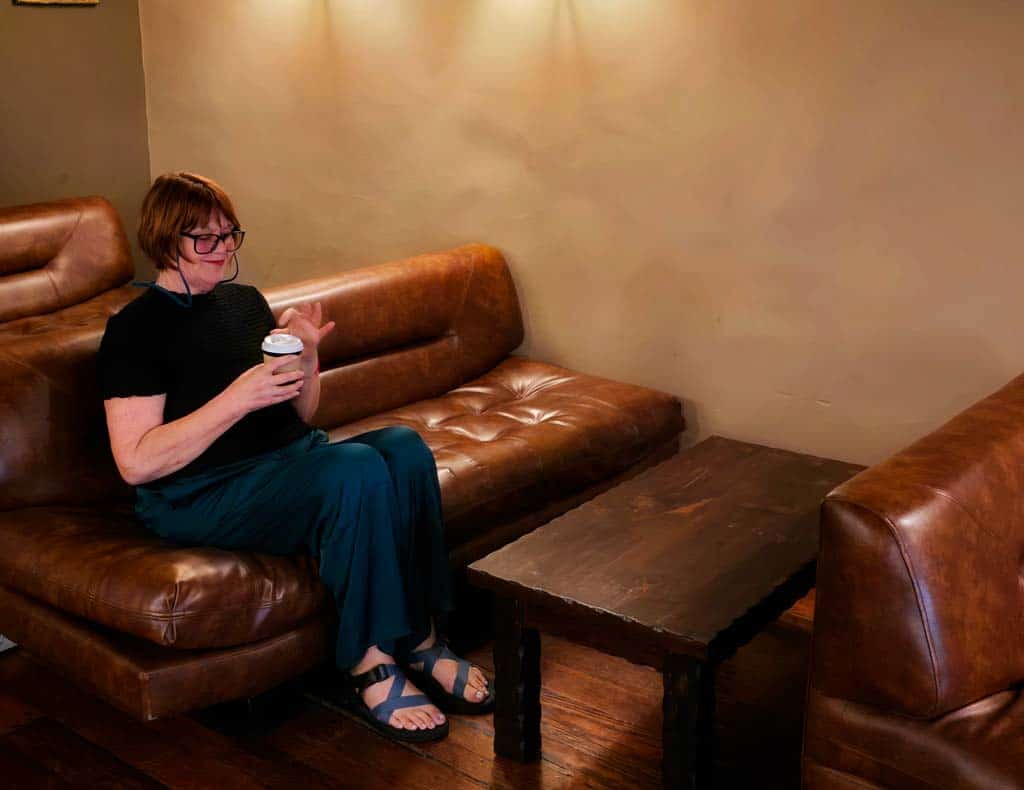 colleen trying the local special blend at Lima Coffee