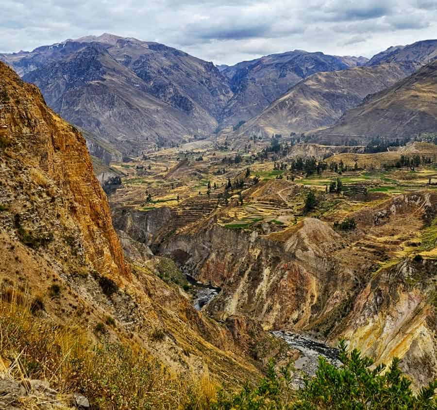 view of terraced farms and villages in the colca valley