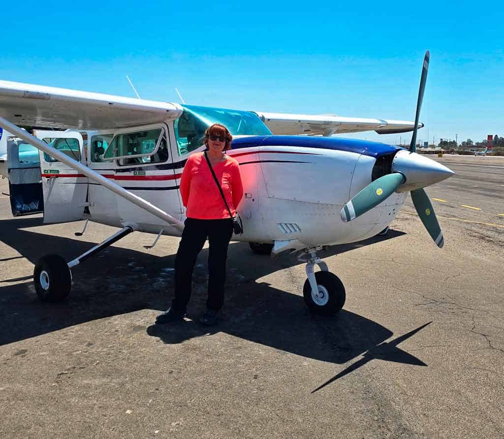 colleen in front of the small nazca flight plane