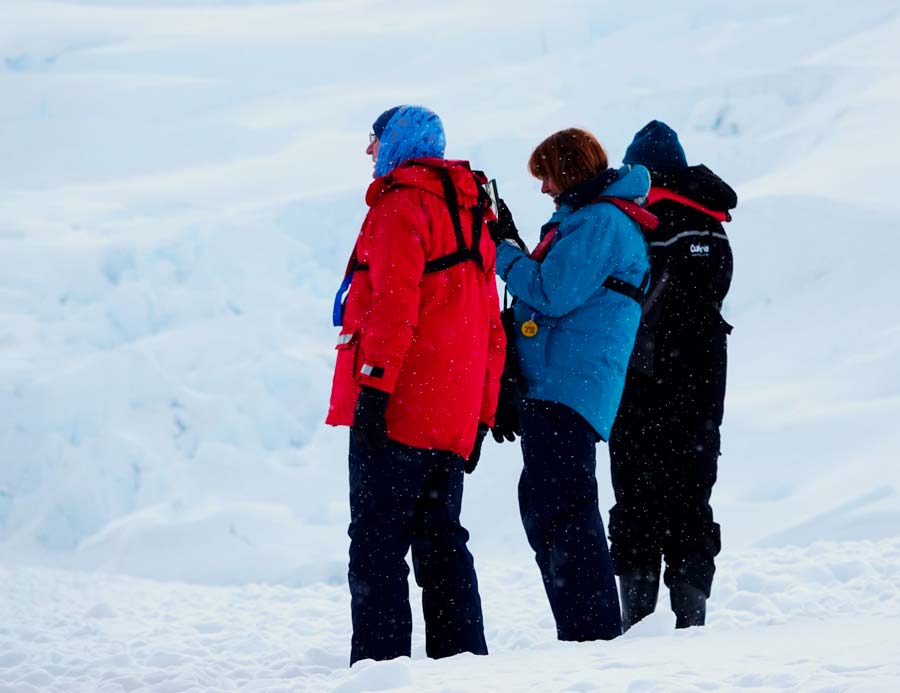 colleen and gerry on the antarctica peninsular taking photos of the view