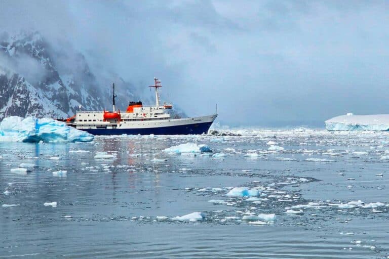 MV Ushuaia sailing through sea ice in Antarctica