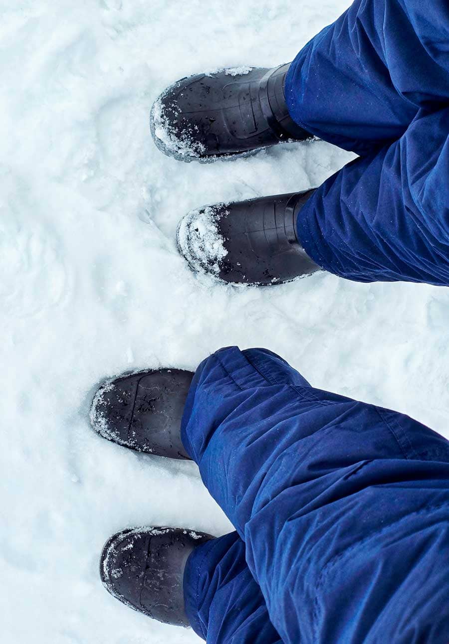 colleen and gerry feet in boots as they land on south shetland island
