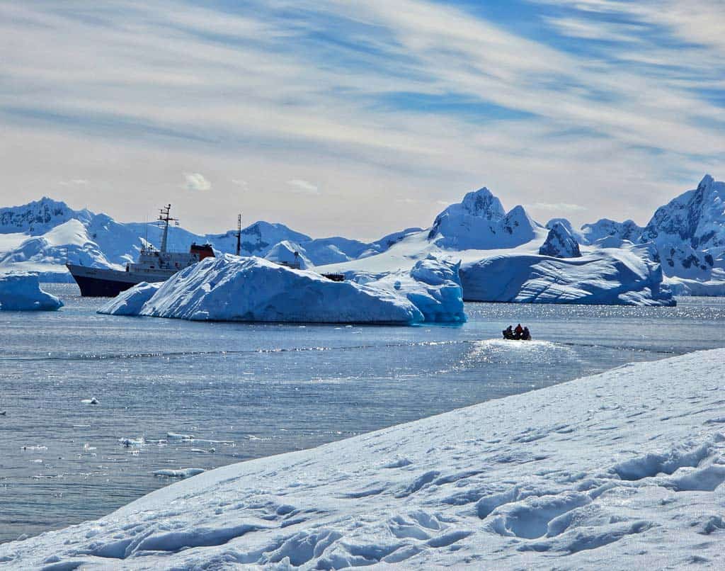 stunning view of the ice and a zodiac making it's way back to the ship