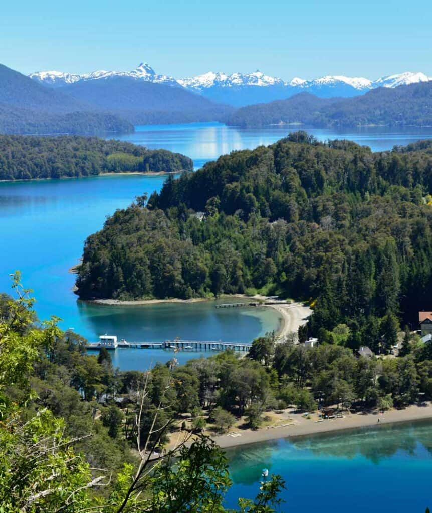 drone view of the Argentinian lakes and distant mountains (photo by Photo by Noe De Angelis)