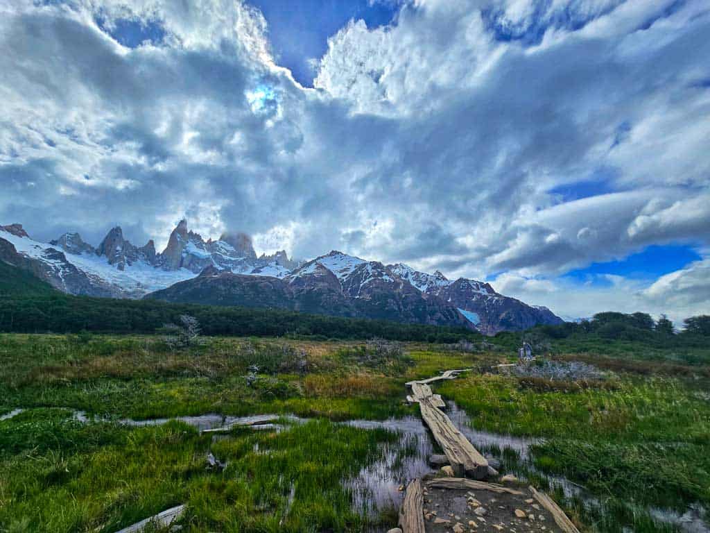 walking boards across the marsh on the Fitzroy hike, with the mountain in the background