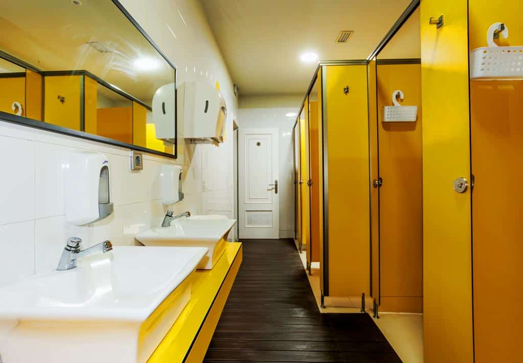 a typical camino bathroom with private showers